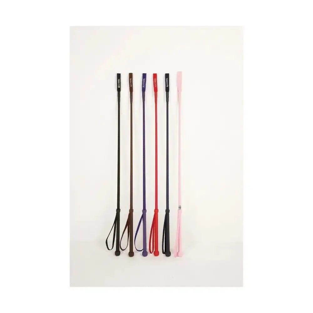 Six equestrian riding whip crops in black brown purple red and pink with leather handles and matching handle keepers