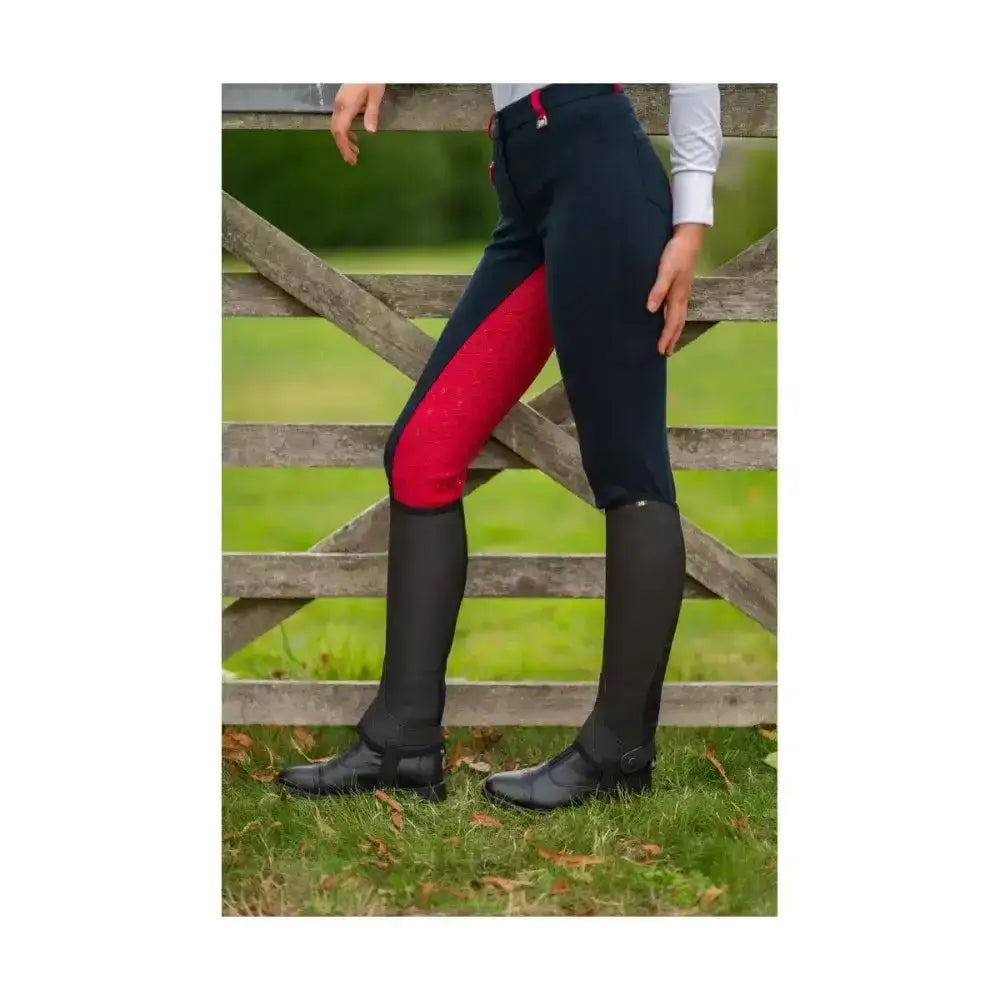 Black equestrian saxby silicone jodhpurs with bold red thigh panel made from durable stretch fabric
