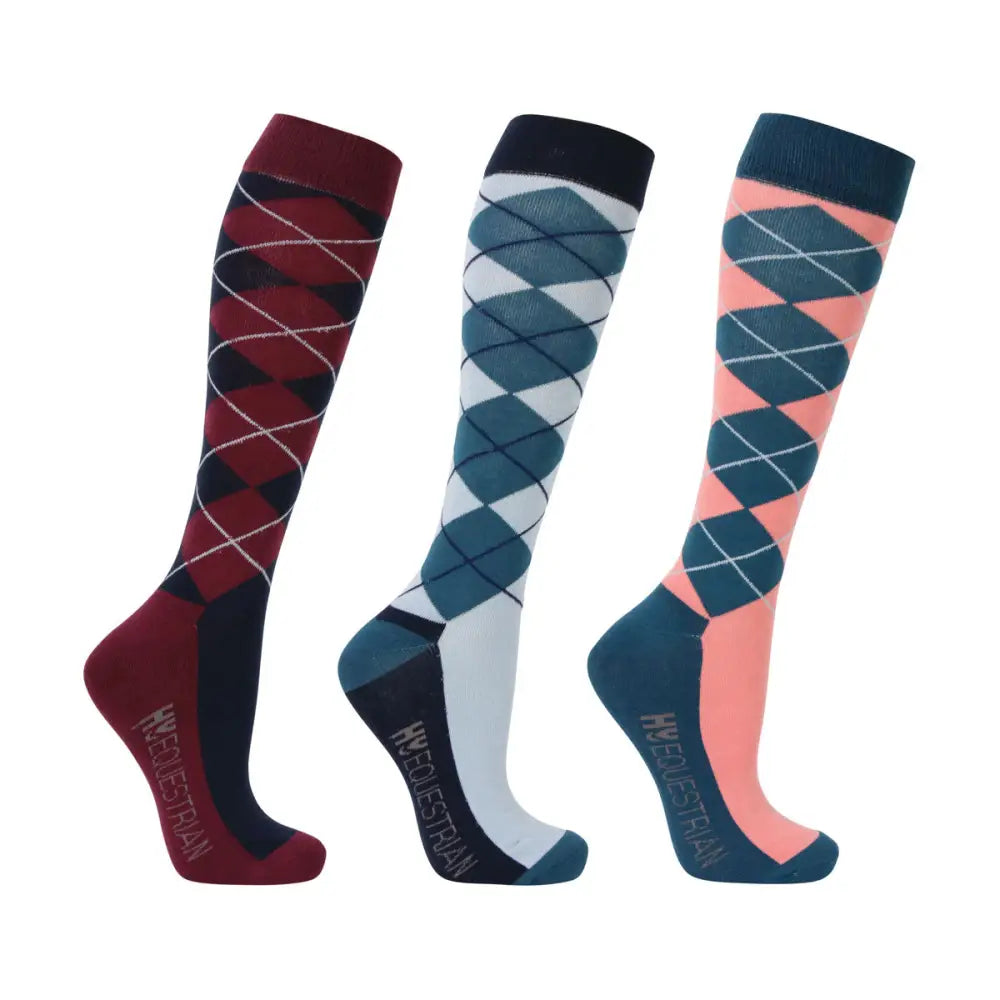 Three pairs of hy equestrian synergy argyle socks in maroon navy teal white and peach with ribbed cuffs