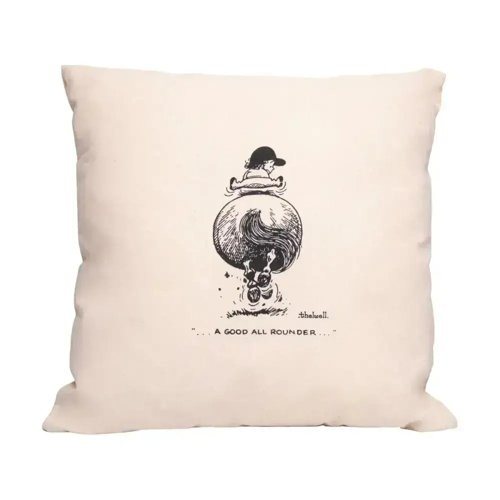 Beige cotton throw pillow from the equestrian thelwell collection with black ink child riding horse design skull below labeled a good all rounder
