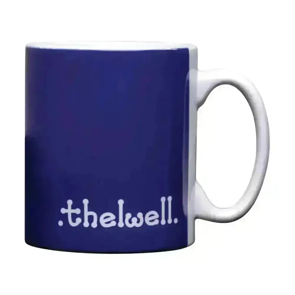 A navy blue ceramic mug with white handle and thelwell collection mugs text from hy equestrian thelwell collection