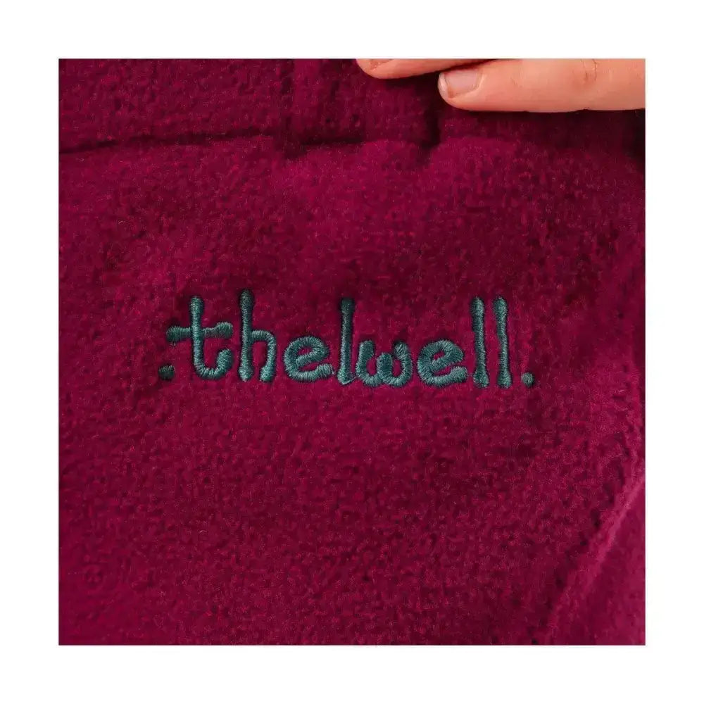 A plush deep burgundy fleece jodhpurs with thelwell embroidered in dark teal from the equestrian thelwell collection pony