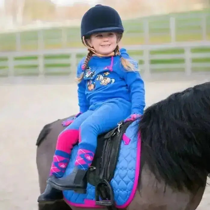 Blue and pink quilted horse saddle pad with black stirrups from hy equestrian thelwell collection race fleece tots jodhpurs