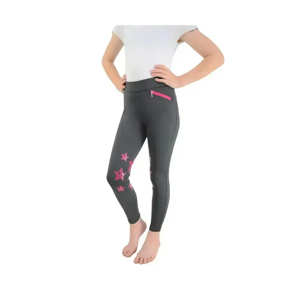 Dark gray equestrian theodora children’s riding tights with pink star patterns and a pink zipper pocket on the thigh