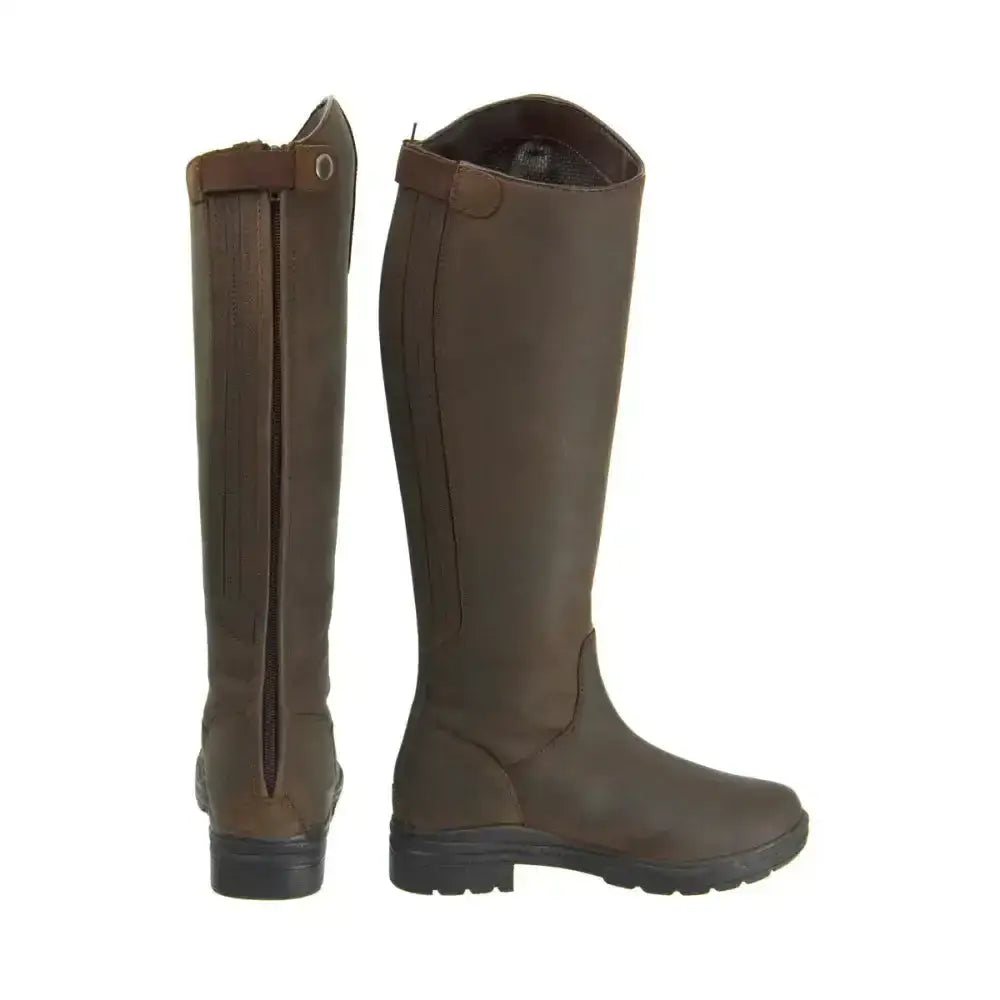 Brown leather equestrian waterford country riding boots with back zipper and black rubber soles shown from the back side