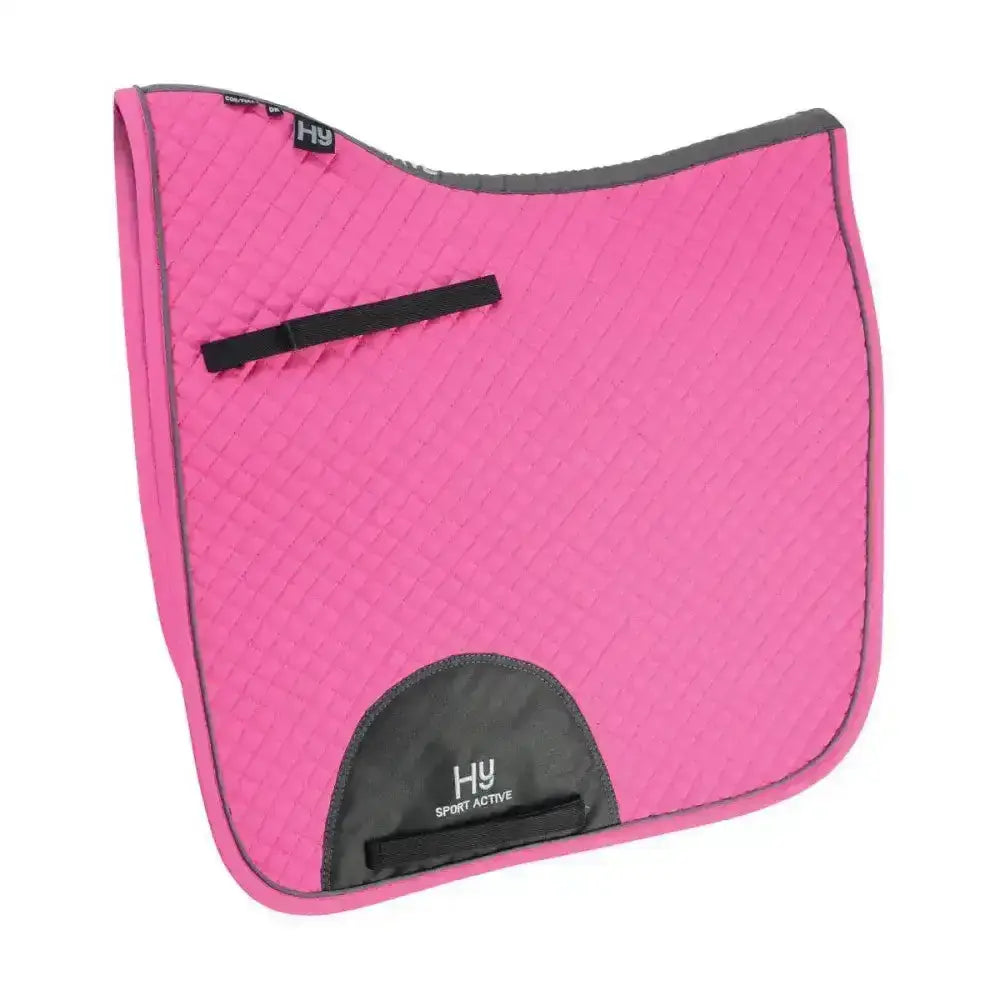 Bright pink quilted hy sport active dressage saddle pad with black trim and branded logo patch for sport active dressage