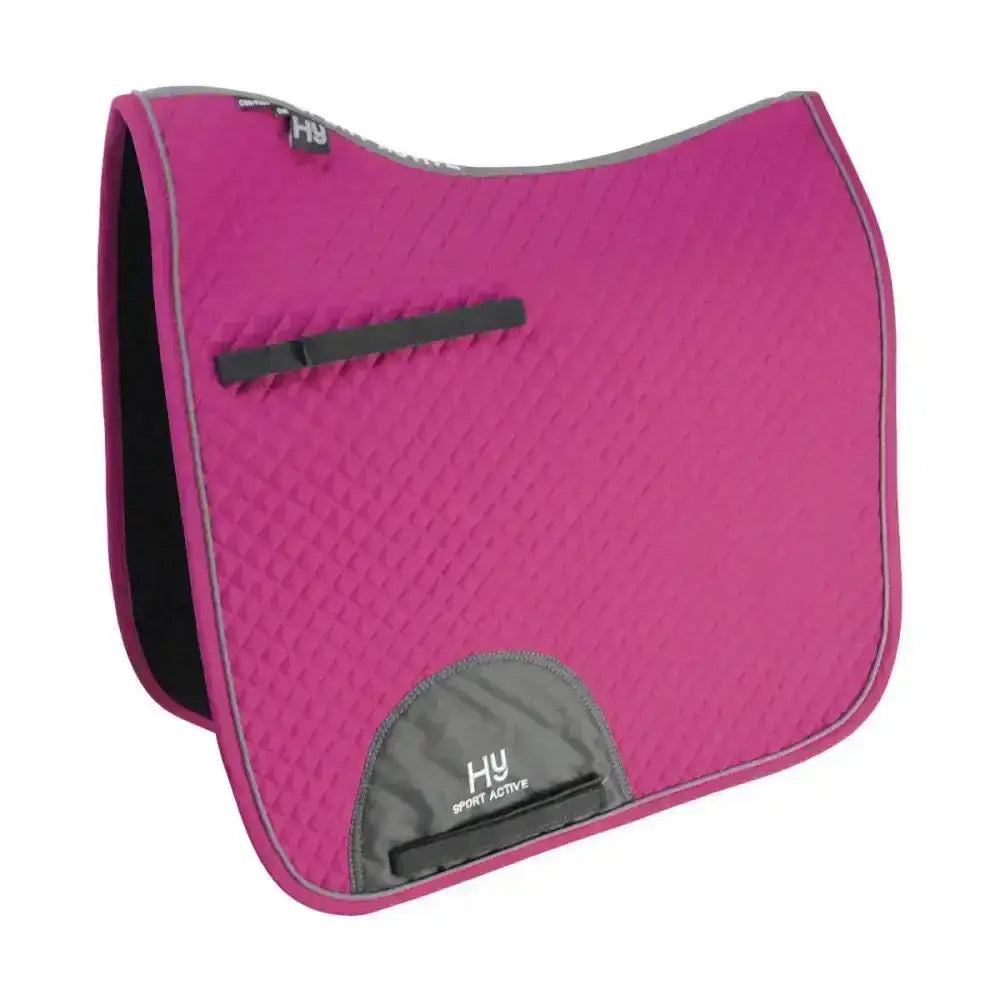A vibrant pink hy sport active dressage saddle pad with quilted texture gray trim and signature hywither cut for sport active dressage