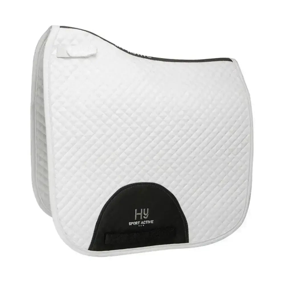 White quilted hy sport active dressage saddle pad with black trim and branded patch featuring signature hywither cut
