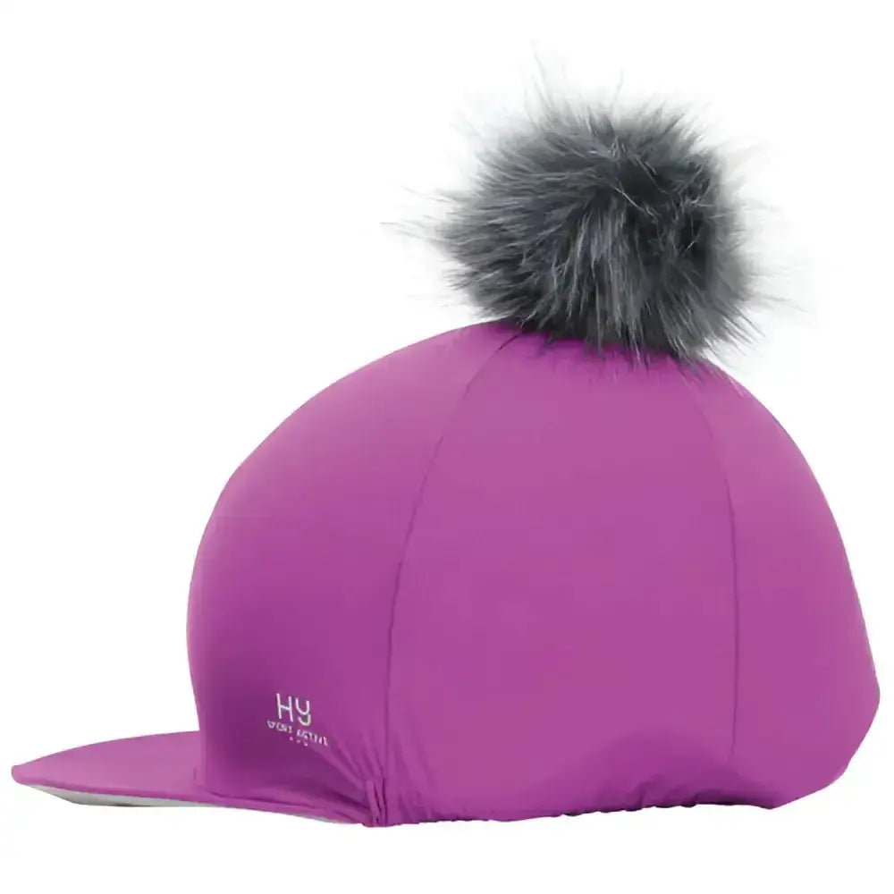 A vibrant purple hy sport active hat silk with a gray faux fur interchangeable pom pom on top