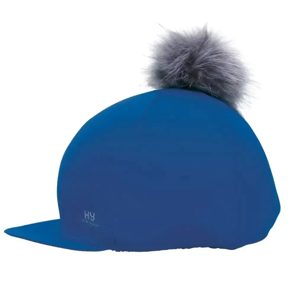 Blue helly hansen sport active hat with gray faux fur interchangeable pom pom and silver hy sport detail