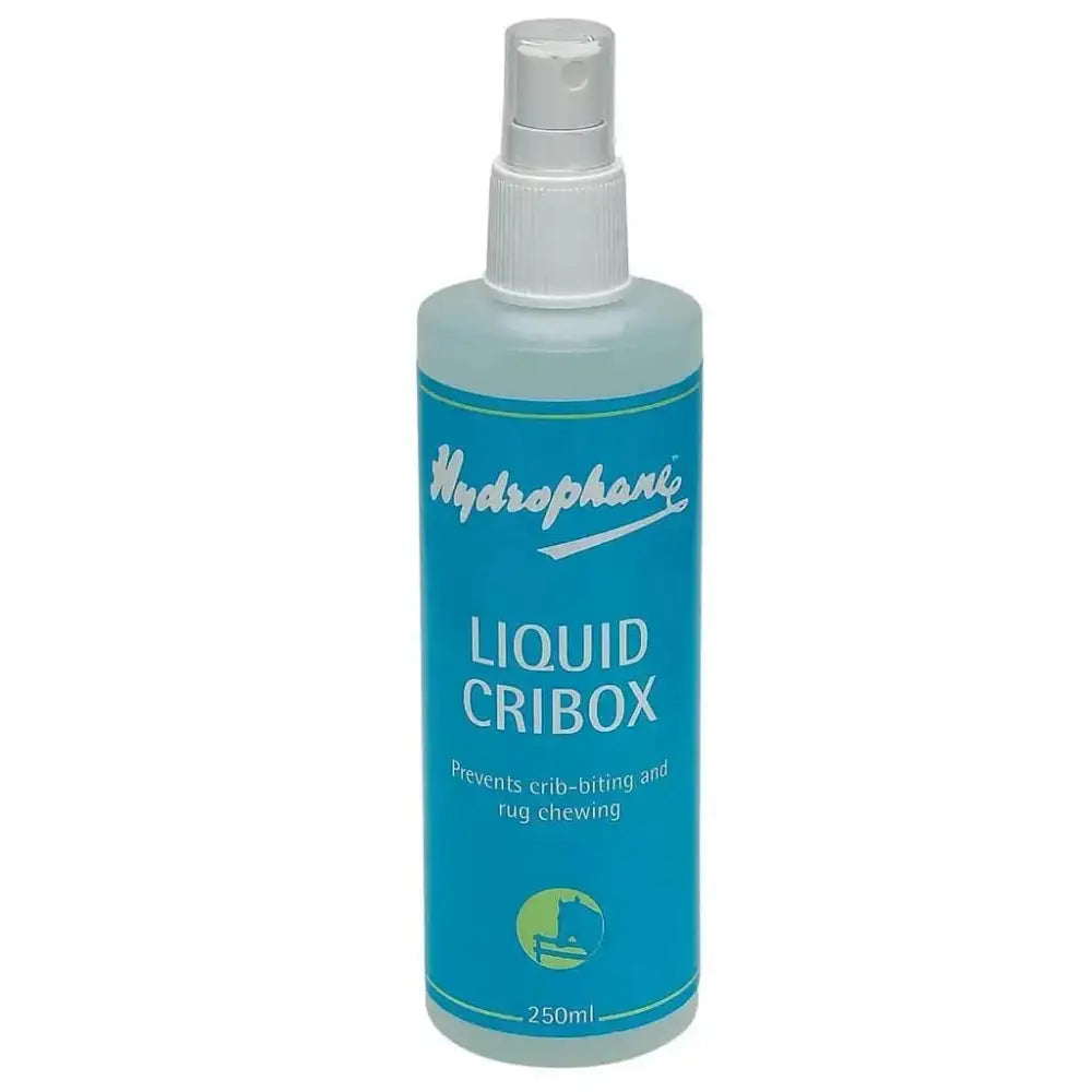 A translucent blue hydrophane liquid cribox spray bottle with white nozzle for preventing crib-biting and rug chewing