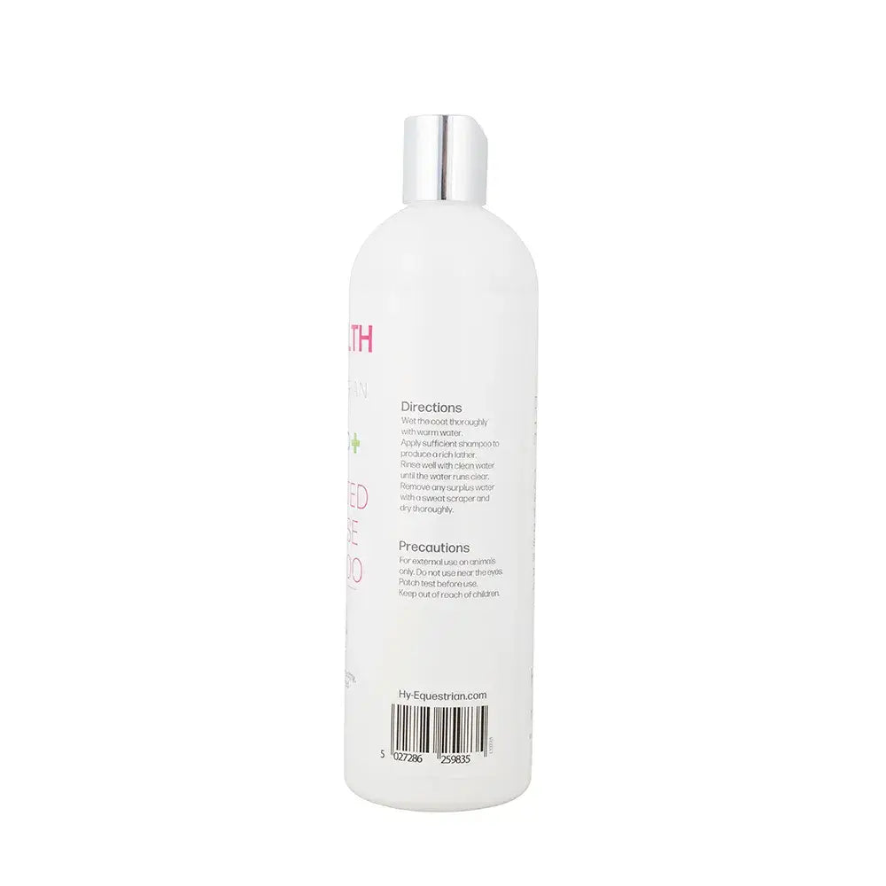White plastic bottle with silver cap showing the back label of hyhealth medicated cleanse shampoo directions and precautions