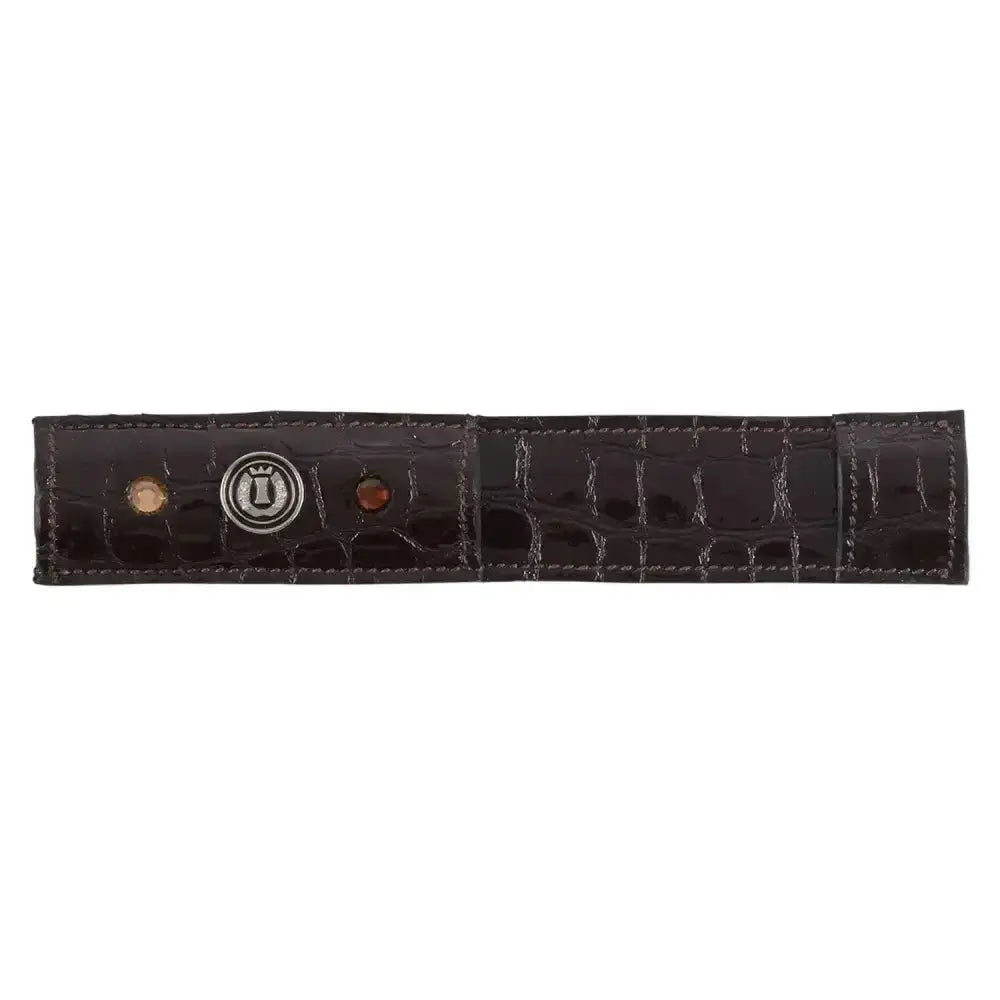 Dark brown crocodile-embossed pardouz leather riding spur protectors with silver logo and two decorative stones