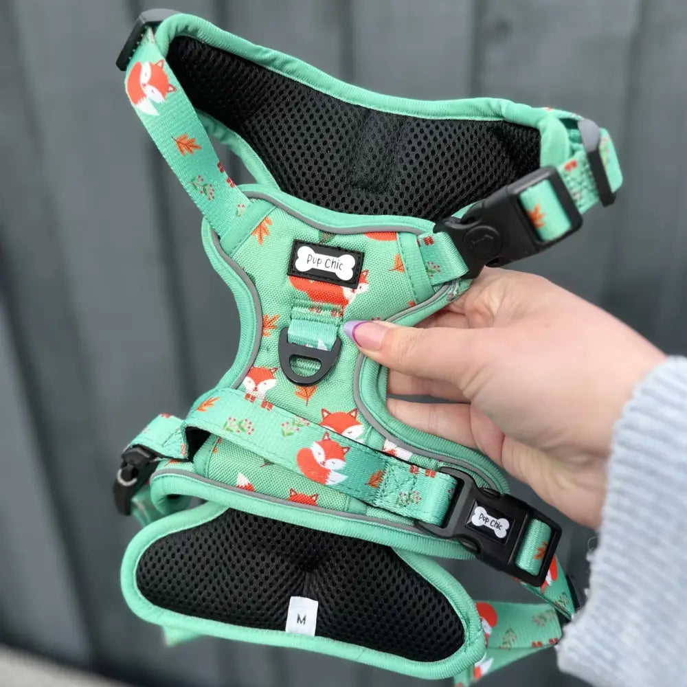 Mint green inquisitive fox tactical dog harness with fox print, black mesh padding, adjustable buckles, no pull design