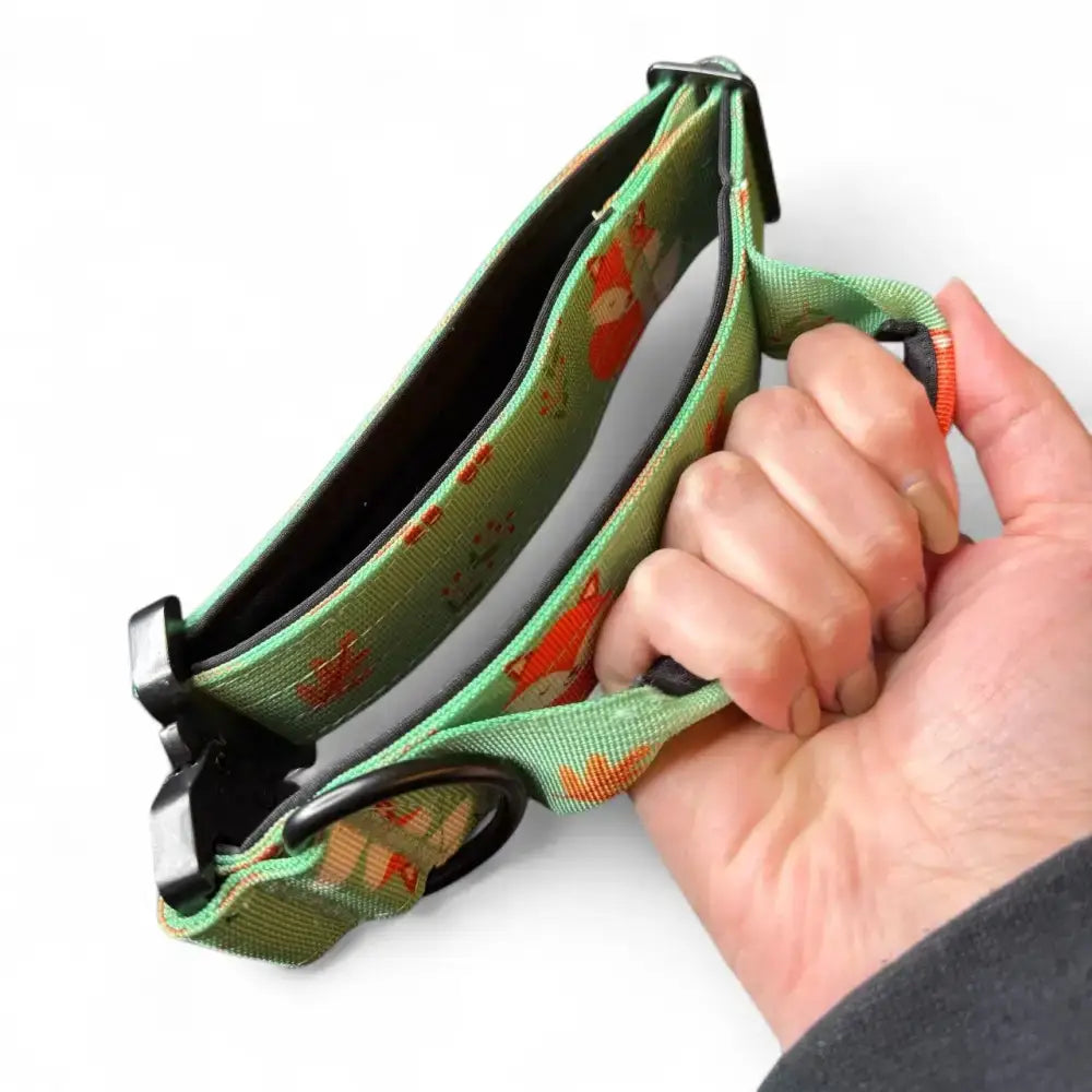 Green fabric tactical dog collar with orange fox print and black plastic hardware woodland style inquisitive fox tactical