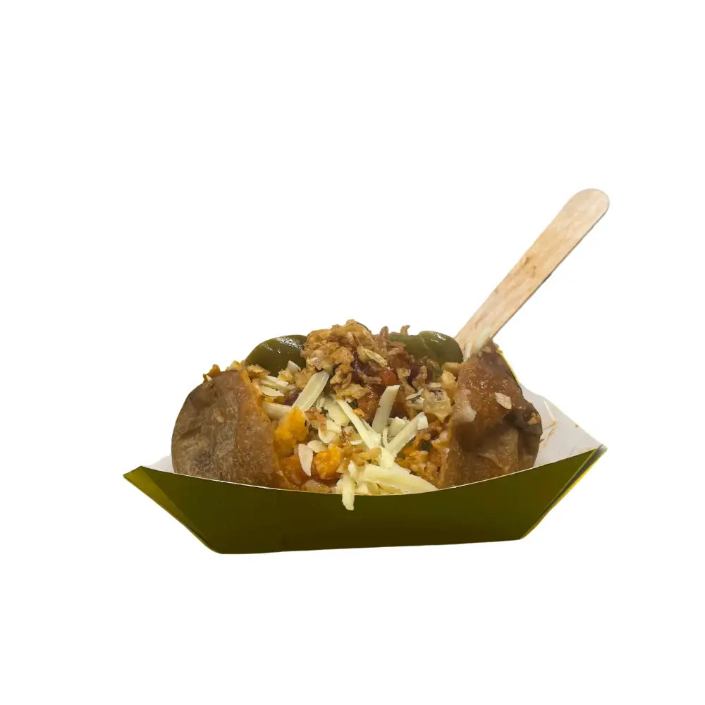 A savory jacket potato with butter cheese topped with shredded cheese and greens in a green tray perfect for equestrian fans