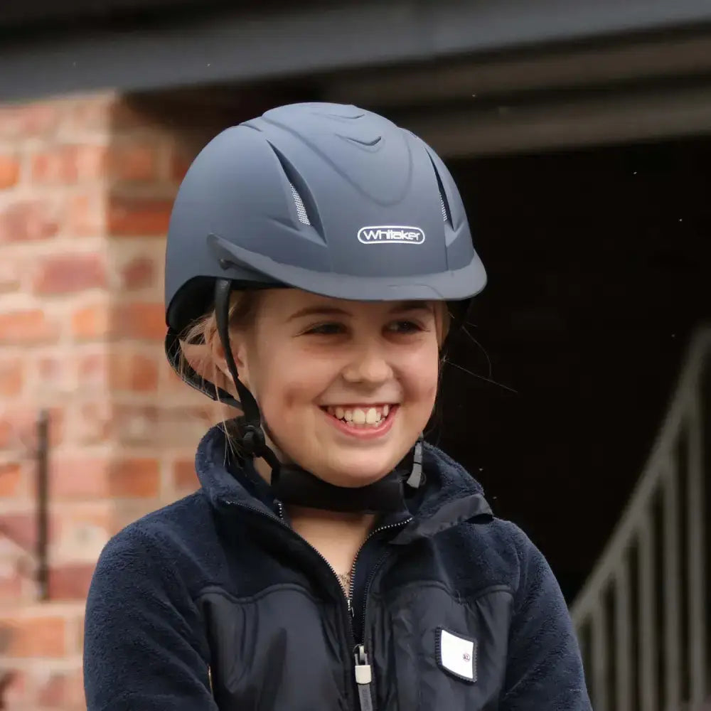 Dark gray john whitaker nrg riding helmet rh040 adjustable with ventilation slots and sleek aerodynamic design