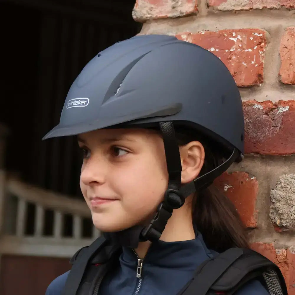 Dark gray john whitaker nrg riding helmet rh040 adjustable with sleek design and black straps for young riders