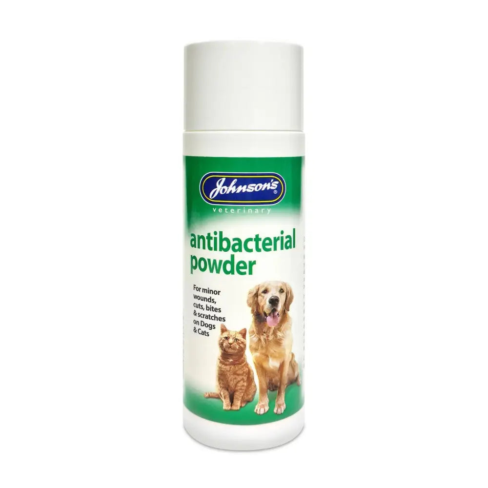 Johnson’s veterinary antibacterial powder in a white container with green label and dog and cat images for antiseptic dry dressing
