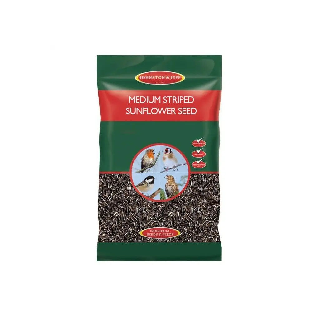 A green and red package of johnston and jeff medium striped sunflowerseed with a clear window showing dark seeds inside