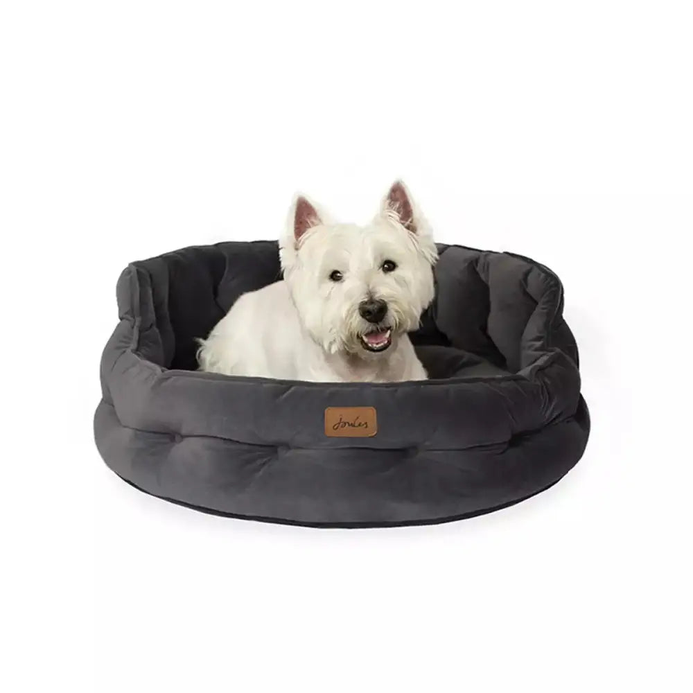 Dark grey plush joules chesterfield pet bed with soft quilted texture and leather tag perfect for sleeping dogs lie
