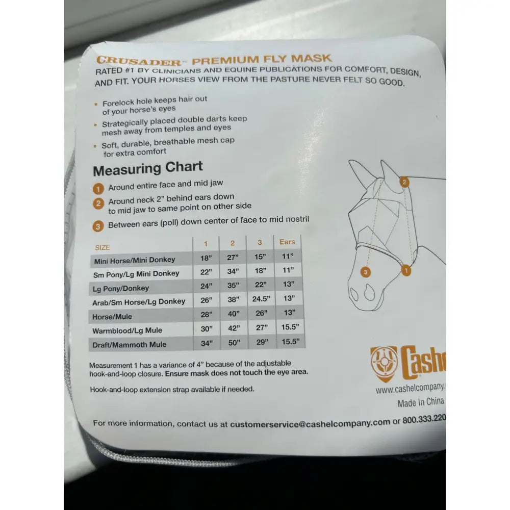 Packaging of crusader premium cashel fly mask donkey long nose cover with ears featuring sizing charts in white orange and black