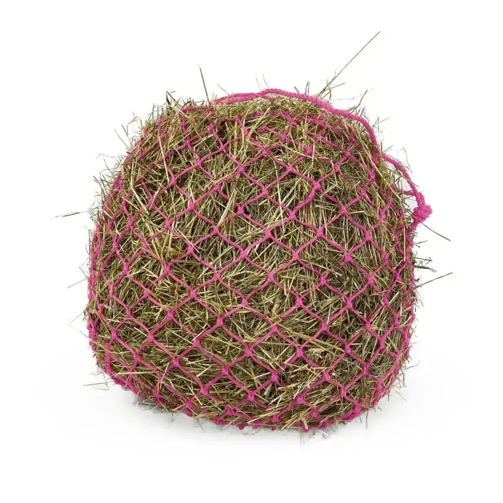 A round hay ball in a vibrant pink woven km elite deluxe haynet made of extra strong polyethylene for durability