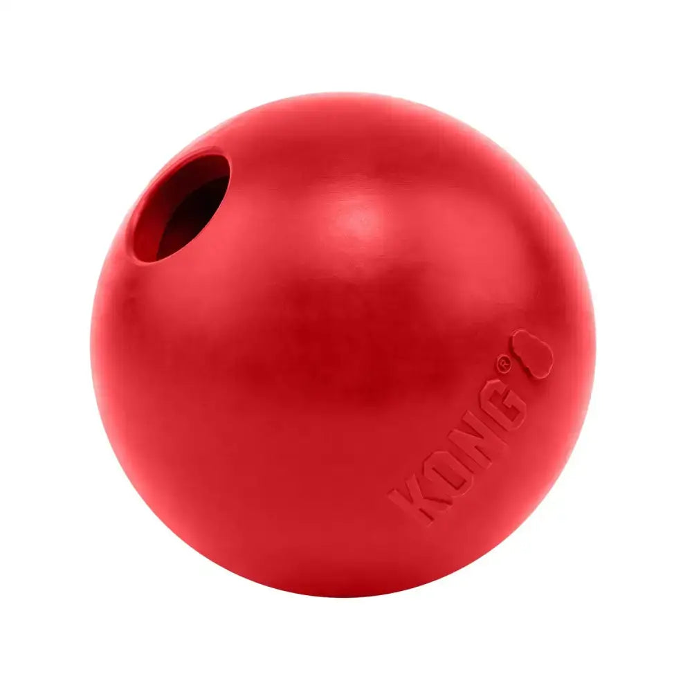 Red kong ball dog toy with hole for stuffing or tossing perfect for kong ball fun with horses and equestrian play
