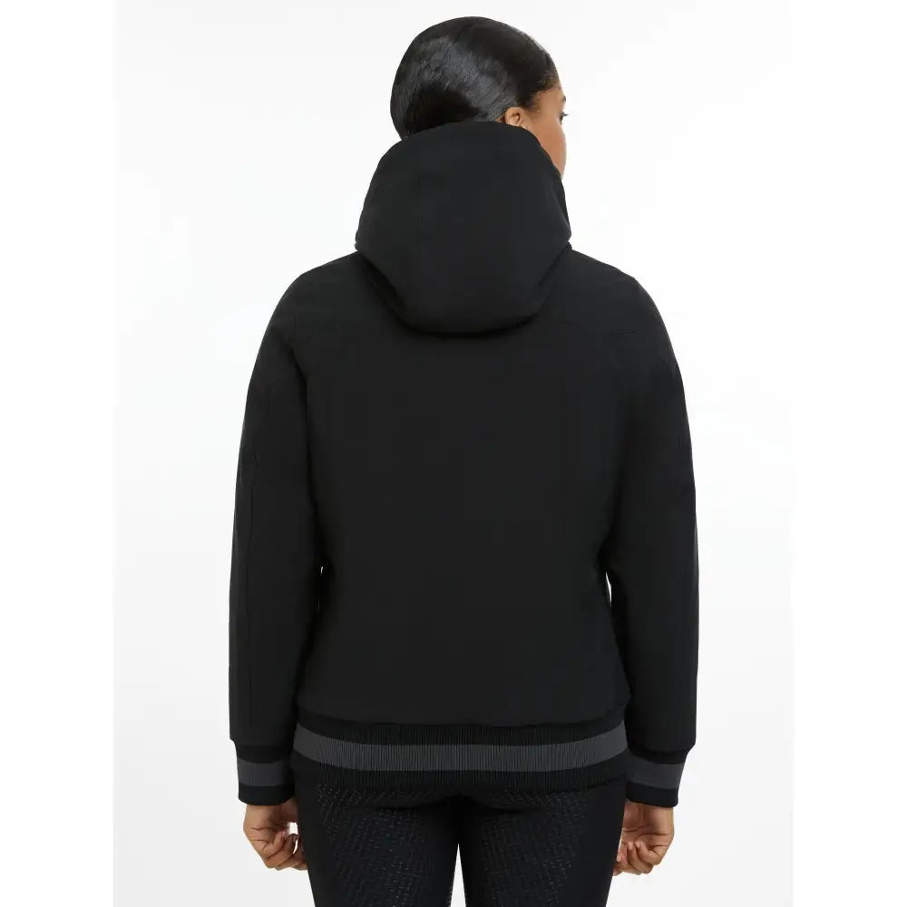 Black hooded ladies team jacket with ribbed cuffs and waistband in a sleek minimalist team jacket black design