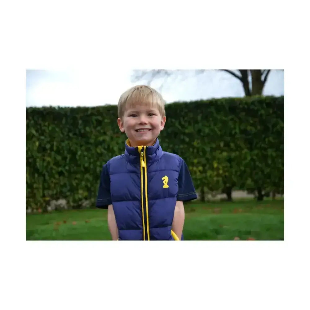 Blue quilted lancelot padded gilet by little knight with yellow zipper cut specifically for lightweight warmth