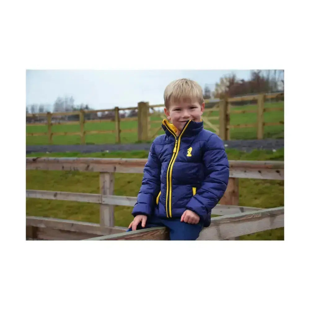 A navy blue lancelot padded jacket with yellow zipper and trim perfect for cold weather outdoor coats