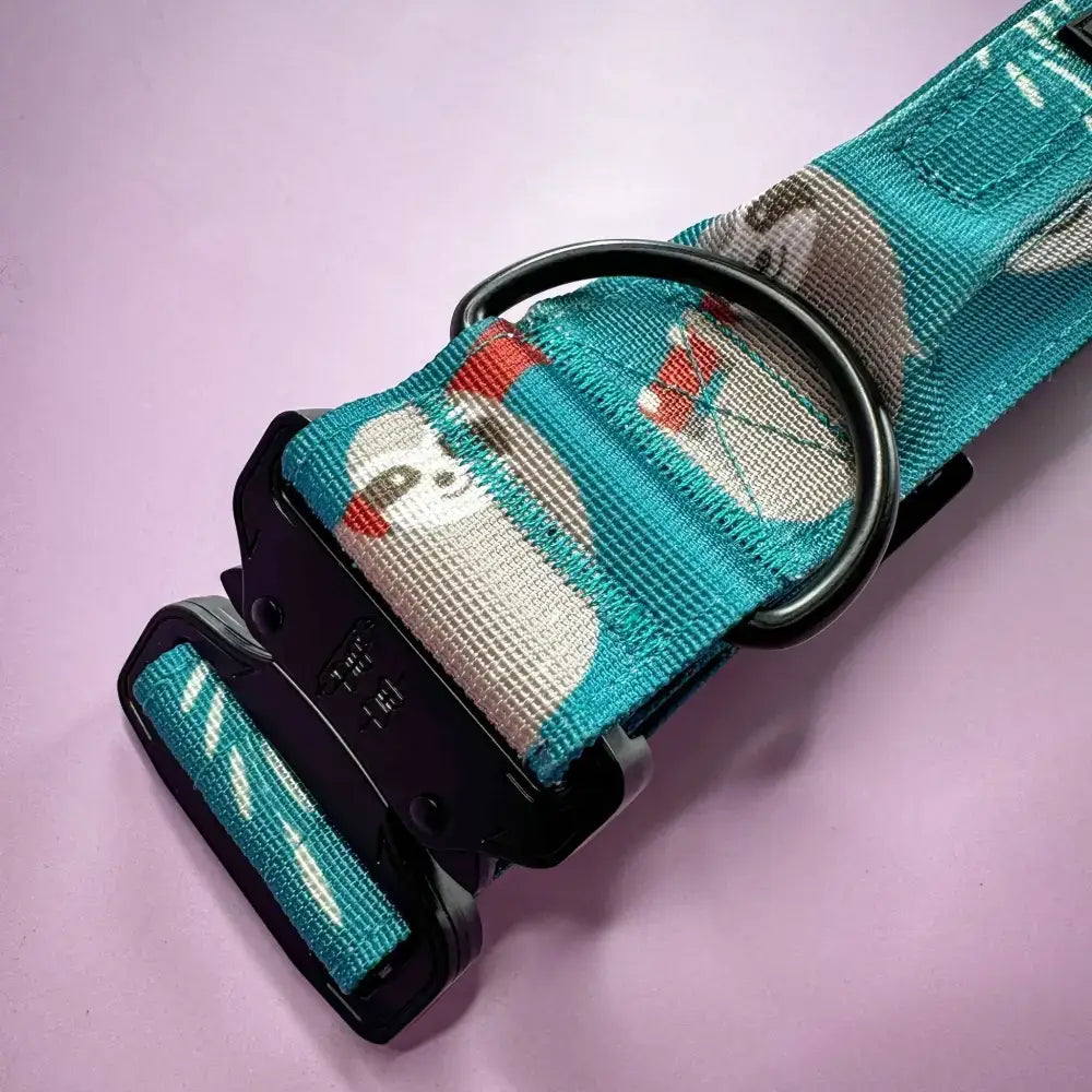 Teal tactical dog collar with black buckle and lazy sloth print on mint green base for large dogs