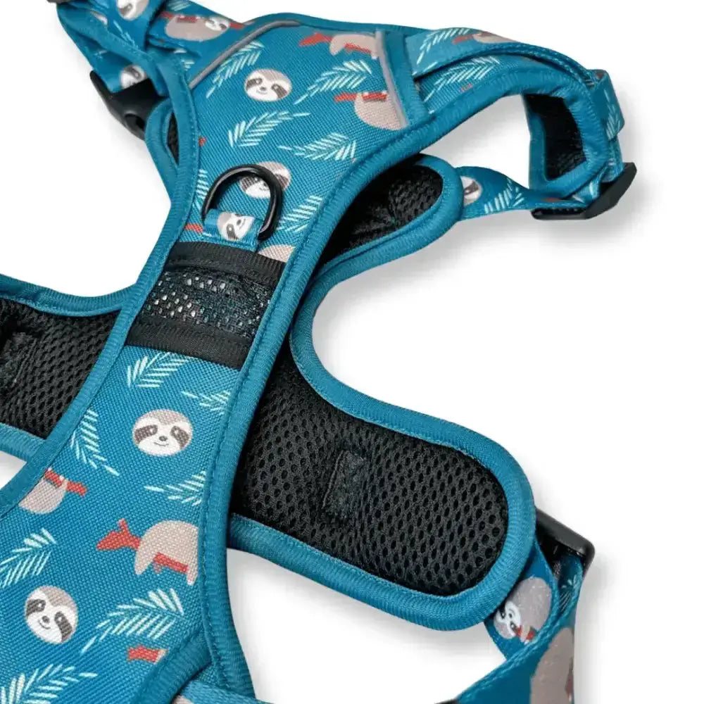 Teal lazy sloth tactical dog harness with playful sloth and palm leaf pattern and black mesh padding for comfort