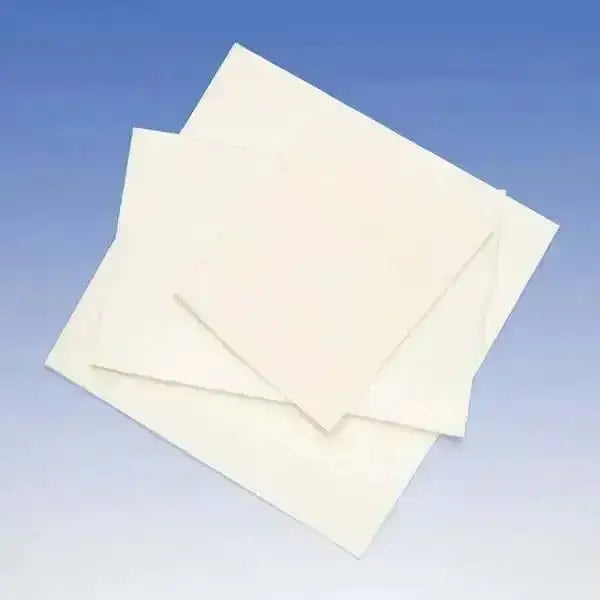 Stack of off-white individual leg bandage pads for horse boots made of soft absorbent material