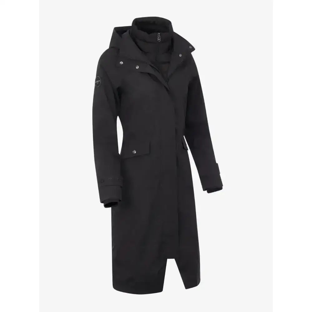 Black lemieux amelie waterproof lightweight riding coat with sleek hooded asymmetrical design and silver hardware