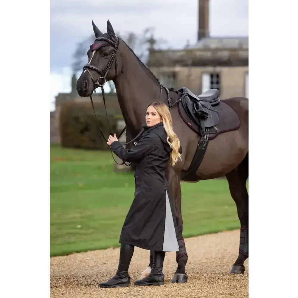 Black lemieux amelie waterproof lightweight riding coat with contrasting gray inner lining for all weather use