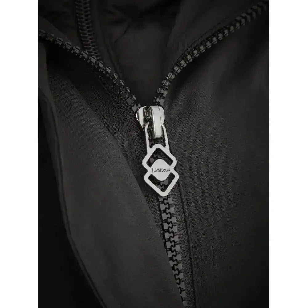 Silver geometric zipper pull engraved lemieux on black lemieux amelie waterproof lightweight riding coat