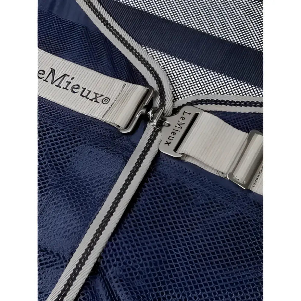 Navy blue mesh fabric with gray striped trim and silver zipper pull on lemieux arika air-tek sheet navy