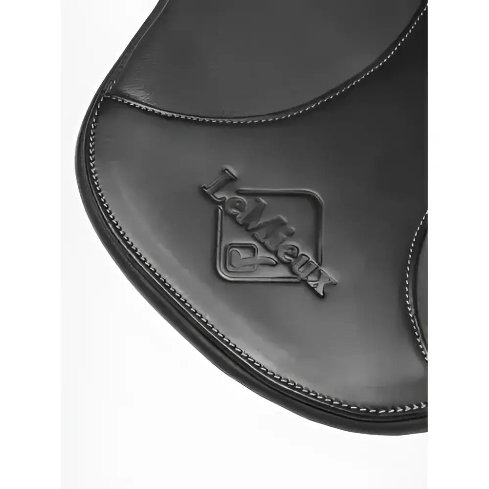 Black leather saddle pad with embossed lambskin logo and stitched edges paired with lemieux arika contoured stud girth black
