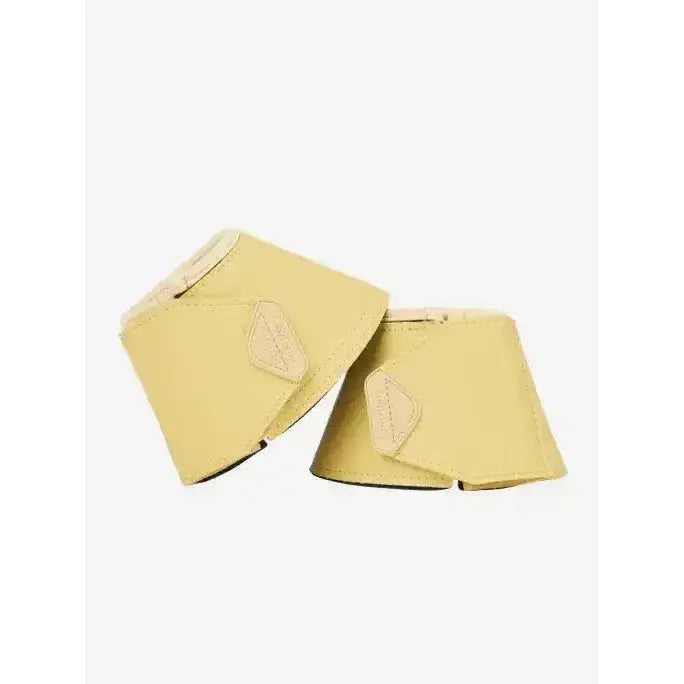 Pair of pale yellow leather lemieux arika reach boots mimosa with light tan stitching and subtle brand patch