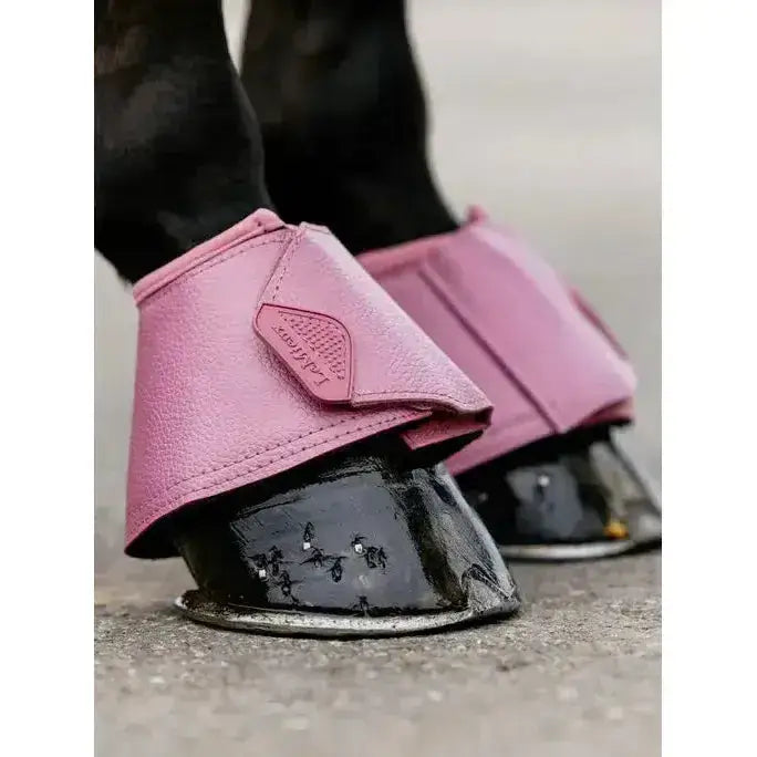 Pink leather lemieux arika reach boots peony with embossed logo and subtle textured finish on horse hoof