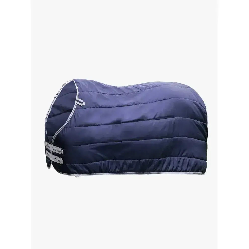 Navy blue quilted lemieux arika rug liner 200g with white trim and zipper details for extra warmth and fit