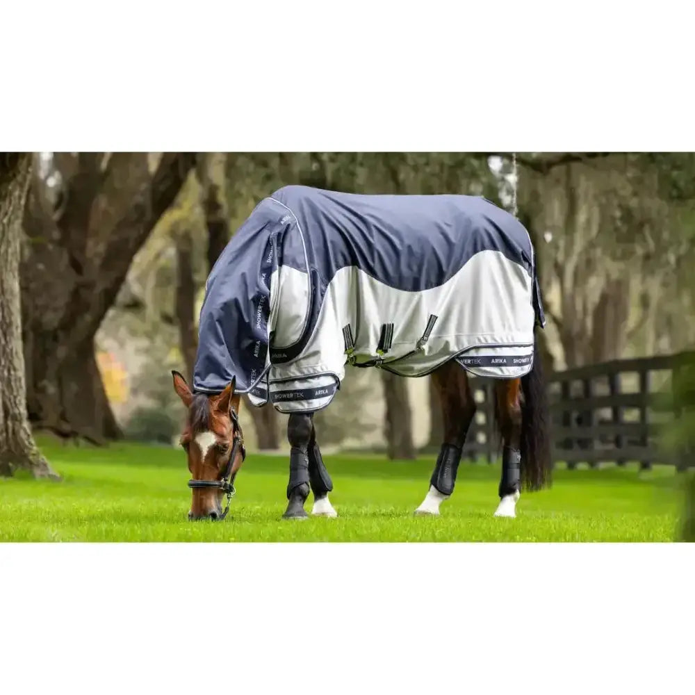 Navy and white two-tone lemieux arika shower-tek fly rug with black straps and branded trim for horse protection