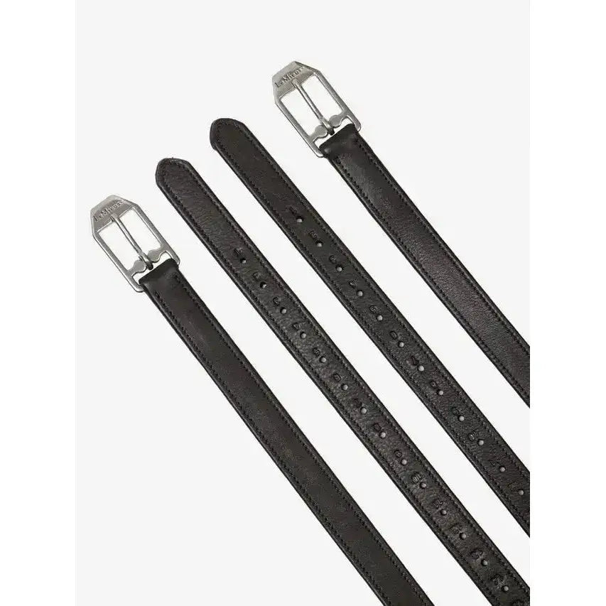 Three black leather belts with silver buckles and subtle texture in sophisticated lemieux style stirrup leather brown