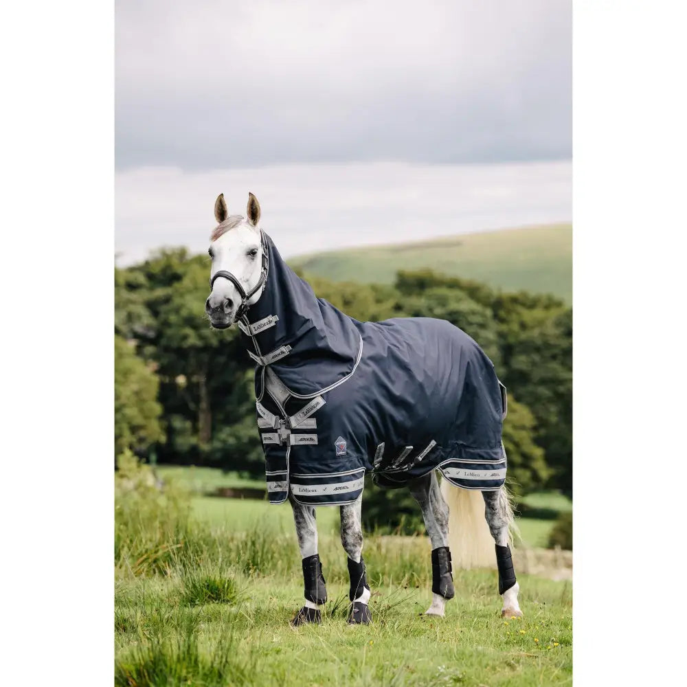 Navy blue lemieux arika storm-tek horse rug with white trim reflective stripes and branded logo on chest 100g storm-tek turnout