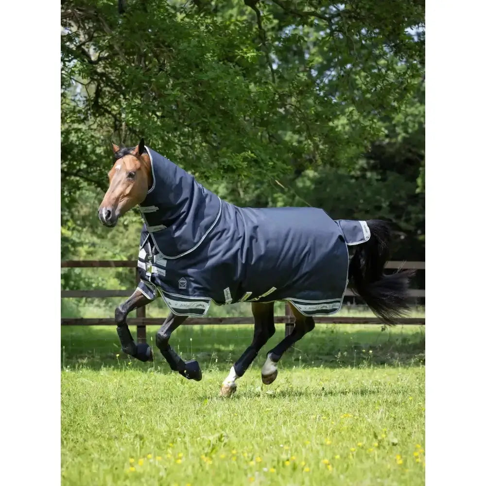Navy blue lemieux arika storm-tek horse rug with white trim and reflective stripes featuring innovation gold award design