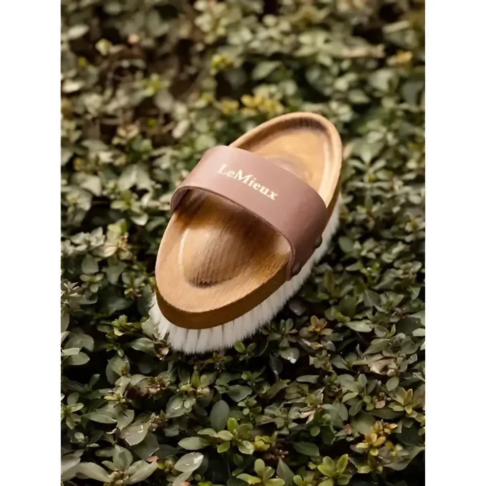 Lemieux artisan soft goats hair brush with wooden body, soft white bristles, and brown leather strap for grooming
