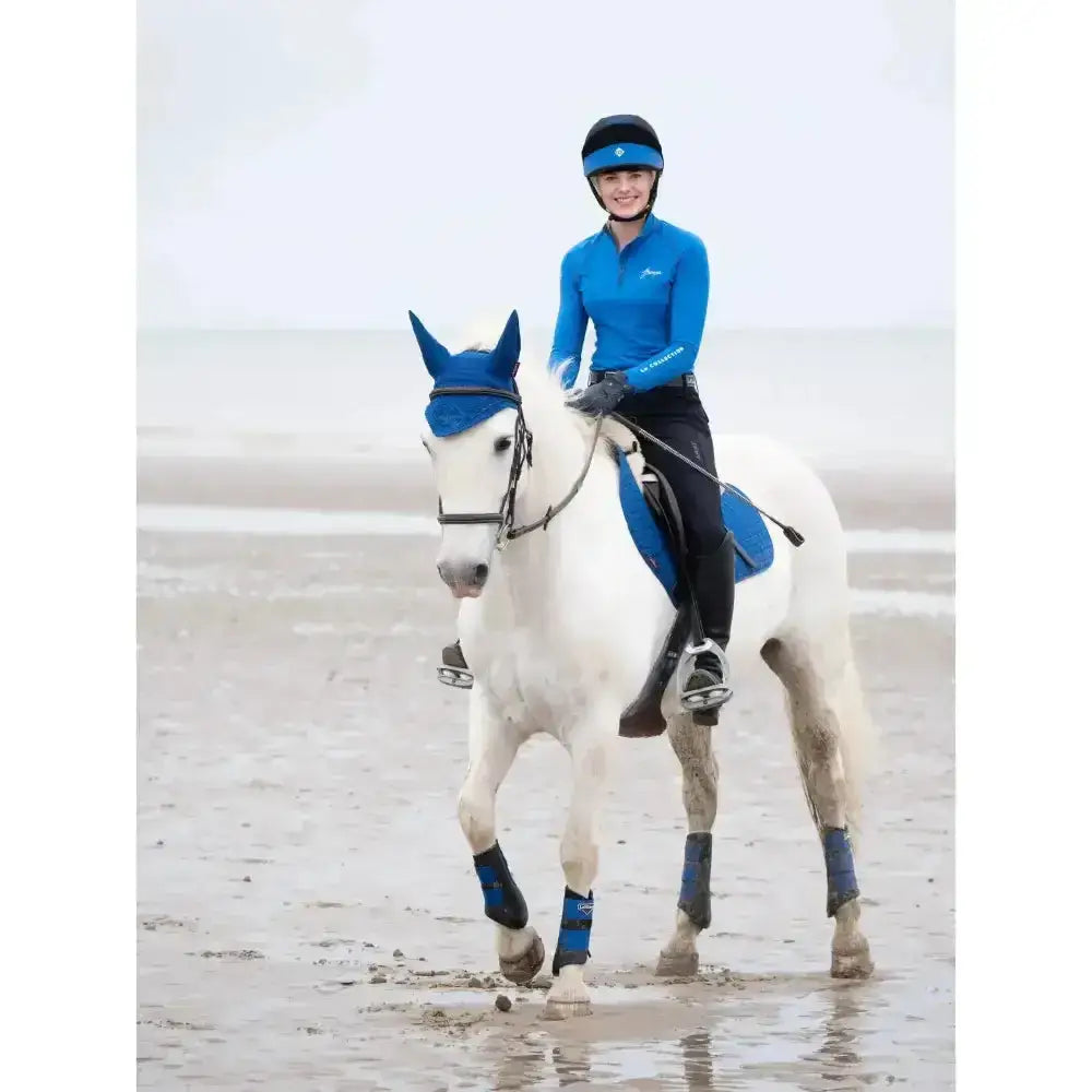 Blue lemieux base layers benetton equestrian helmet with matching heaven brim and subtle logo detail for riding gear