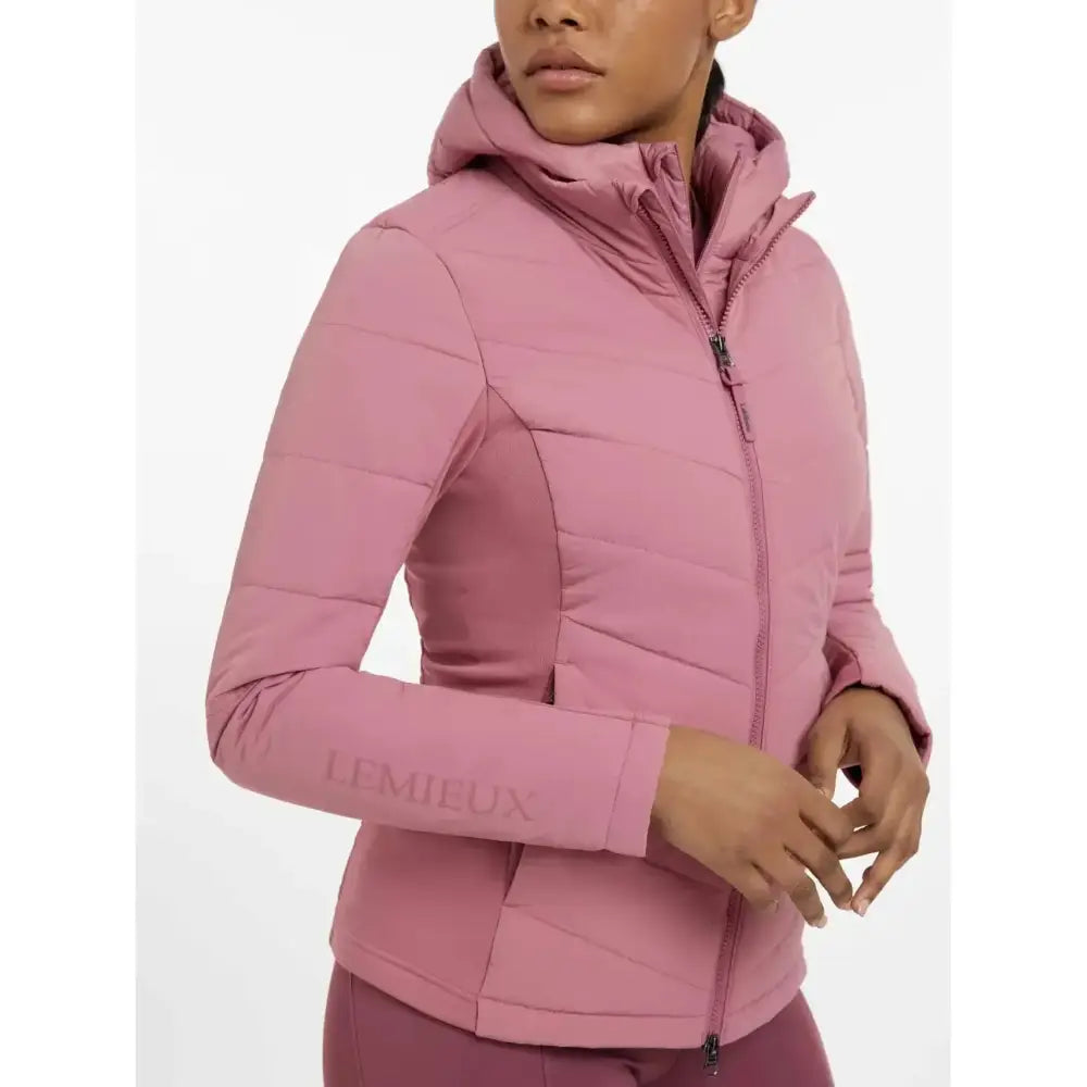A soft pink quilted puffer brioney hybrid jacket with hood and zipper closure from lemieux hybrid jacket peony collection