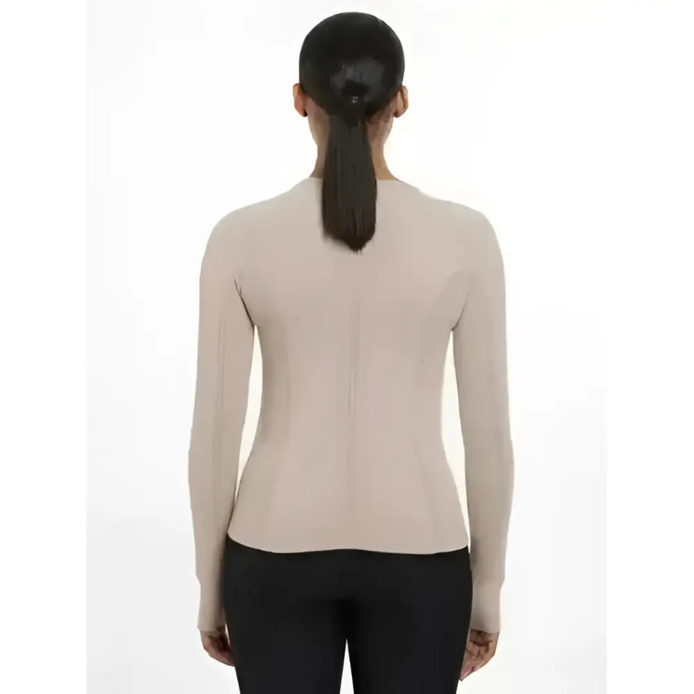 Beige lemieux britney seamless long sleeve top with a fitted design and central zipper on the back
